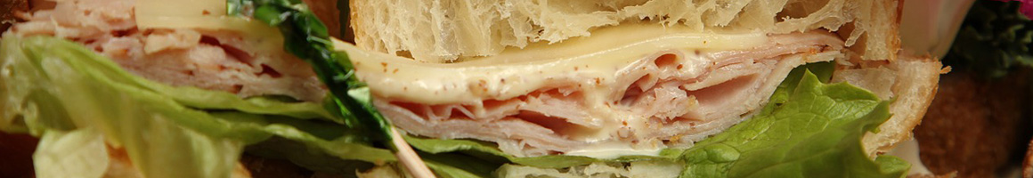 Eating Deli Sandwich Cafe Salad at THE SANDWICH BOSS at Eden Plaza Cafe restaurant in San Francisco, CA.
